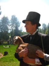 You can't always turn your back on modernity (represented symbolically by this grasping modern hand of a visitor). Keep a firm hold on your historical goat! (A metaphor for something deep, I am sure.) Photograph taken by Lauren Markewicz on 1885 Street at Fort Edmonton Park, 2012.